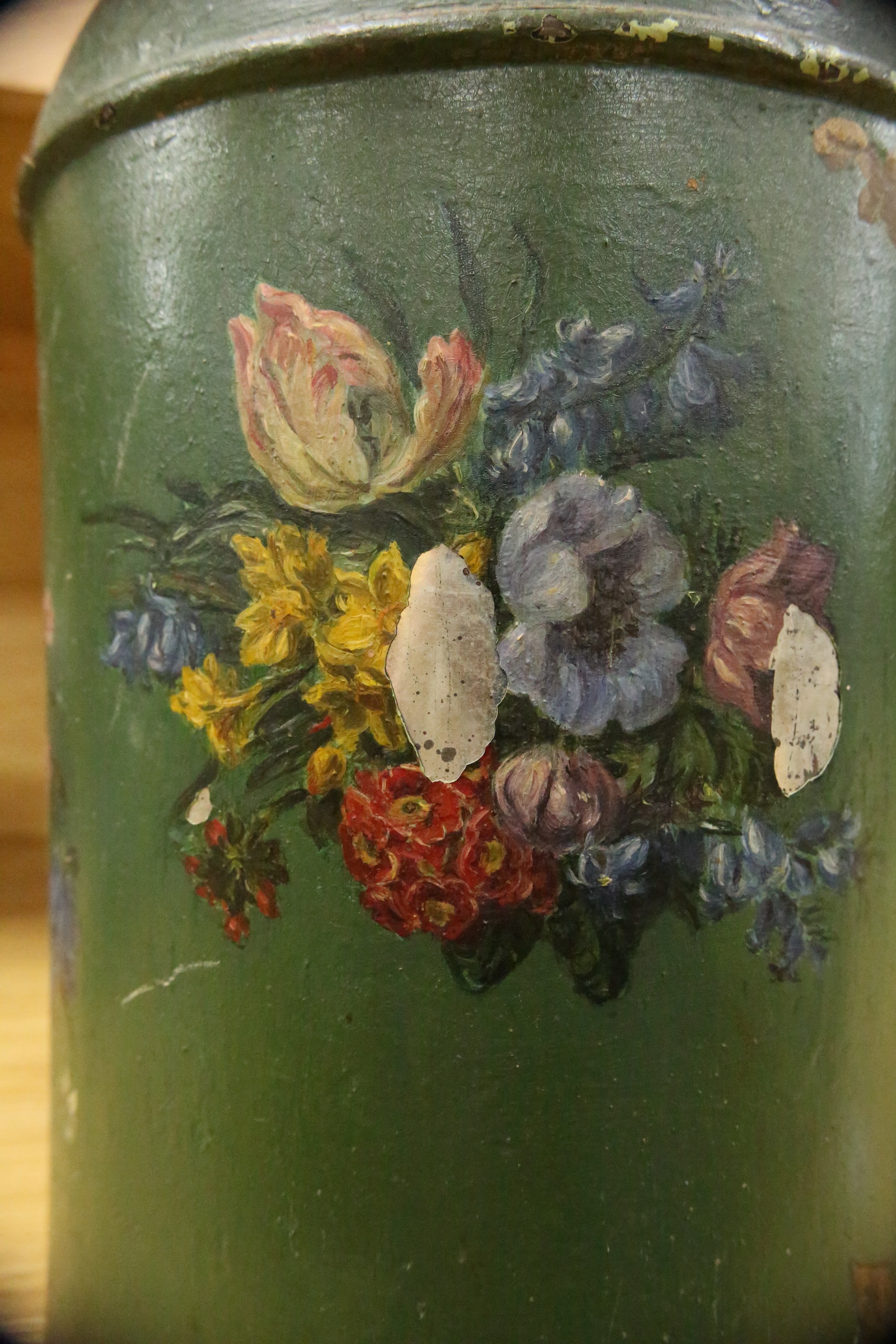 A green toleware floral decorated tea canister, 42cm high. Condition - poor, many chips to surface paint